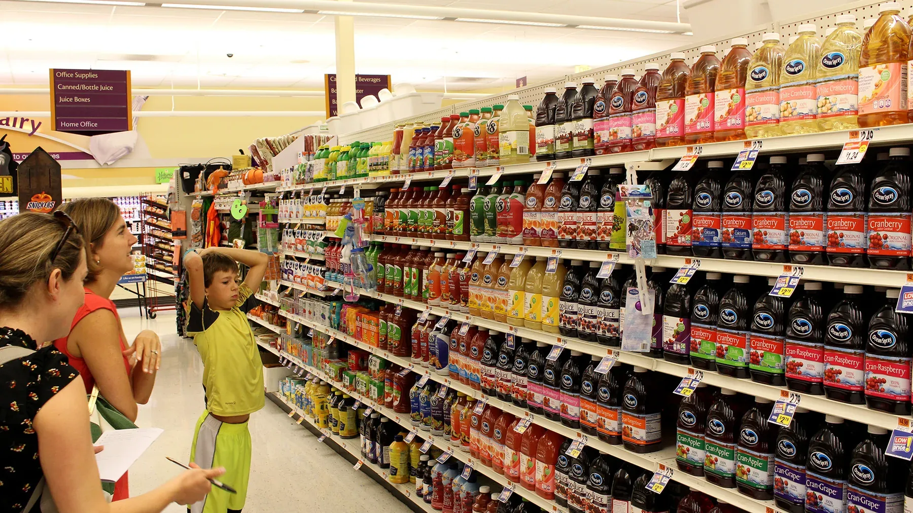 Parent and child observed in supermarket drinks aisle
